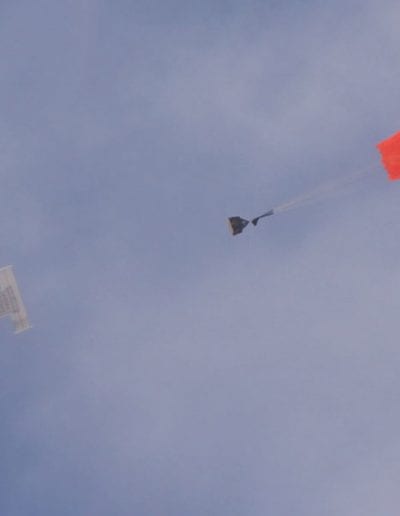 Airplane dropping G11 cargo parachute and cargo
