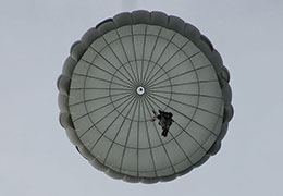 Looking directly up at a descending Invasion II Non-Steerable parachute